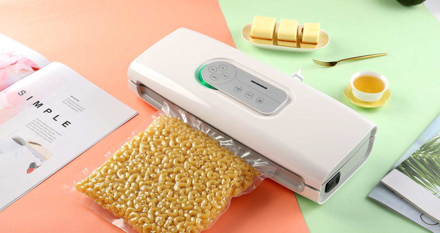 Aparat de vidat si sigilat Heinner HAV-140WH, vidare uscata/ umeda, functie marinare, sistem racire banda sigilare, furtun pentru caserole, mini-cutter incorporat, comptaibil cu pungi latime 30 cm, capacitate vidare: 7-8 l/ min, 0.6 bar, 140W, alb