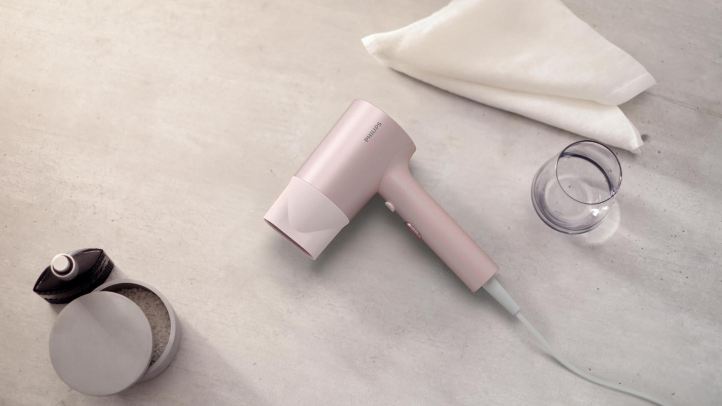 Uscator de par Philips BHD321/50, 1600W, ingrijire cu ioni, 2 setari de viteza, 2 setari de temperatura, cap de coafare, Roz
