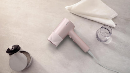 Uscator de par Philips BHD321/50, 1600W, ingrijire cu ioni, 2 setari de viteza, 2 setari de temperatura, cap de coafare, Roz